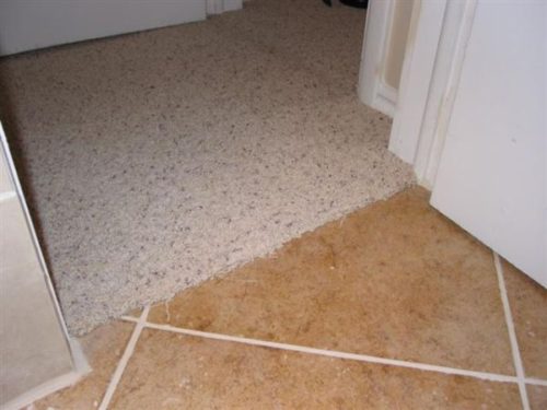 small cut in entry of tile floor