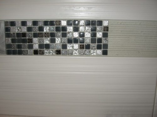 decorative mosaic tile being installed
