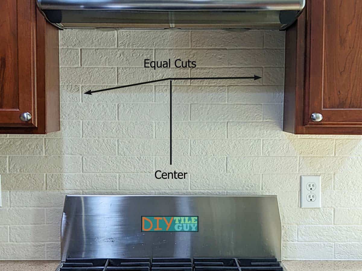 tile is centered behind the stove using the quartering layout technique